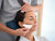 woman massaging her face with a gua sha